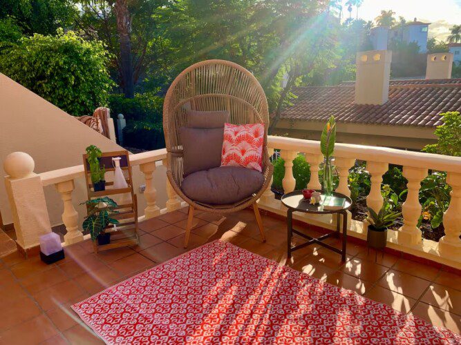 spacious terrace with comfortable furniture and views over the Atlantic Ocean.